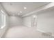 Spacious basement area with neutral carpet, recessed lighting, and large windows, perfect for customization at 4888 Noris Ave, Morrison, CO 80465