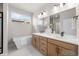 Well-lit bathroom with a soaking tub, walk-in shower, and modern fixtures at 4888 Noris Ave, Morrison, CO 80465