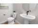 This bathroom showcases a modern sink and toilet setup, complemented by neutral tones and a minimalist design at 4888 Noris Ave, Morrison, CO 80465