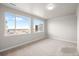 Bright bedroom with large windows offering neighborhood views and ample natural light at 4888 Noris Ave, Morrison, CO 80465