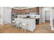 Modern kitchen with stainless steel appliances, an island with seating, and elegant cabinetry at 4888 Noris Ave, Morrison, CO 80465