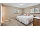 Comfortable bedroom with neutral tones, carpet flooring, and natural light from the windows at 13123 Spica Dr, Lone Tree, CO 80124