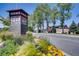 Park Meadows community entrance featuring manicured flower beds and a beautifully landscaped sign at 13123 Spica Dr, Lone Tree, CO 80124