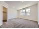 Bright bedroom with neutral carpet, recessed lighting, and closet for optimal storage at 1974 S Haleyville Way, Aurora, CO 80018