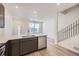 Modern kitchen open to the living room and featuring stainless steel appliances and large island at 1974 S Haleyville Way, Aurora, CO 80018