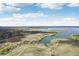 Stunning aerial view of community, walking paths, and lake at 26404 E Caley Dr, Aurora, CO 80016