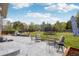 Spacious backyard with stone patio, outdoor seating, grill, and a trampoline for Gathering fun at 26404 E Caley Dr, Aurora, CO 80016