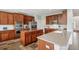 Gourmet kitchen with stainless steel appliances, custom cabinetry, and a center island perfect for meal prep at 26404 E Caley Dr, Aurora, CO 80016