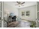 Home office bathed in sunlight with a ceiling fan, and view of the garden at 26404 E Caley Dr, Aurora, CO 80016