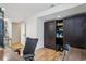 Office with wood floors, built in cabinets and a desk at 26404 E Caley Dr, Aurora, CO 80016
