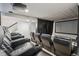 Home theater featuring comfortable seating with drink holders and a large screen at 26404 E Caley Dr, Aurora, CO 80016
