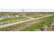 Scenic walking path with a white fence next to community at 26404 E Caley Dr, Aurora, CO 80016