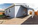 Spacious backyard featuring a large deck with backyard access and blue painted siding at 1451 S Quitman St, Denver, CO 80219
