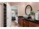 Bathroom showcasing a vessel sink on a granite countertop with a view into a bedroom at 1451 S Quitman St, Denver, CO 80219