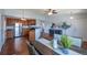 Bright kitchen and dining area with stainless steel appliances and stylish hardwood flooring at 1451 S Quitman St, Denver, CO 80219