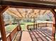 Covered back deck with a view of the backyard and surrounding greenery at 4060 Shaw Blvd, Westminster, CO 80031