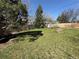 Spacious backyard with lush grass and a wooden fence for privacy at 4060 Shaw Blvd, Westminster, CO 80031