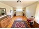 Bedroom featuring hardwood floors, bright window with lace curtains and vintage furniture decor at 4060 Shaw Blvd, Westminster, CO 80031