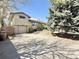 Exterior side view of single Gathering home with brick and siding details plus attached garage and a spacious driveway at 4060 Shaw Blvd, Westminster, CO 80031