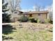 Charming single Gathering home featuring a lush front yard and a traditional brick facade at 4060 Shaw Blvd, Westminster, CO 80031