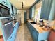 Quaint kitchen featuring custom cabinets, modern appliances, and tiled floor, perfect for culinary enthusiasts at 4060 Shaw Blvd, Westminster, CO 80031