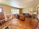Spacious living room featuring hardwood floors, large windows, and comfortable seating arrangements at 4060 Shaw Blvd, Westminster, CO 80031