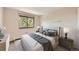 Serene bedroom features a queen-size bed, ample natural light, and modern decor at 1008 N Corona St # 403, Denver, CO 80218