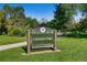 Cheesman Park signage surrounded by lush greenery and walking paths on a sunny day at 1008 N Corona St # 403, Denver, CO 80218