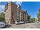 Apartment building features brick exterior, geometric trim, and multi-paned windows at 1008 N Corona St # 403, Denver, CO 80218