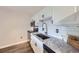A kitchen featuring white cabinets and stainless steel appliances with subway tile backsplash at 1008 N Corona St # 403, Denver, CO 80218