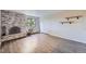 Spacious living room showcases a brick fireplace, hardwood floors, and great natural light at 1008 N Corona St # 403, Denver, CO 80218