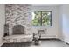 Living room featuring a stone fireplace and a window view with natural light at 1008 N Corona St # 403, Denver, CO 80218