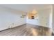 Bright open-concept living room featuring hardwood floors and access to a modern kitchen at 1008 N Corona St # 403, Denver, CO 80218