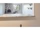 Living room view featuring a stone fireplace and shelving, from the breakfast bar at 1008 N Corona St # 403, Denver, CO 80218