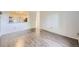 Open living room with hardwood floors and an opening to the well-lit kitchen at 1008 N Corona St # 403, Denver, CO 80218
