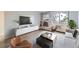 Comfortable living room with modern furnishings, fireplace, and a large window with natural light at 1008 N Corona St # 403, Denver, CO 80218