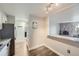 View from the kitchen area into the living room with stone fireplace at 1008 N Corona St # 403, Denver, CO 80218