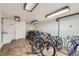 Well lit indoor bike storage room with multiple bike racks and overhead lighting at 1008 N Corona St # 403, Denver, CO 80218