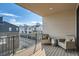 Private balcony with comfortable seating, offering scenic views of the community and neighborhood at 1764 Peak Loop, Broomfield, CO 80023