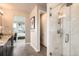 Luxurious bathroom with marble shower, dual vanities, and seamless access to the main bedroom at 1764 Peak Loop, Broomfield, CO 80023