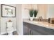 Powder room with modern sink, gray countertop, stylish fixtures, and decorative art at 1764 Peak Loop, Broomfield, CO 80023