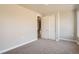 Well-lit bedroom with neutral paint, soft carpet, and a closet at 1764 Peak Loop, Broomfield, CO 80023