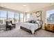 This spacious bedroom offers a luxurious feel with plenty of natural light and stylish accents at 1764 Peak Loop, Broomfield, CO 80023