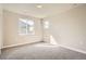 Well-lit bedroom with neutral paint, soft carpet and two bright windows at 1764 Peak Loop, Broomfield, CO 80023