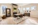 Bright dining area with modern fireplace, lots of natural light, and stylish decor at 1764 Peak Loop, Broomfield, CO 80023