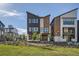New construction townhome exterior featuring mixed materials and modern design at 1764 Peak Loop, Broomfield, CO 80023