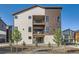 Three-story exterior showcasing modern design, balconies, and landscaping at 1764 Peak Loop, Broomfield, CO 80023