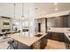 This modern kitchen has a large island and stainless steel appliances at 1764 Peak Loop, Broomfield, CO 80023