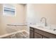 Bright laundry room with sink, folding table, and storage at 1764 Peak Loop, Broomfield, CO 80023