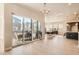 Open-concept living area with a large sliding door and views of the outdoor deck at 1764 Peak Loop, Broomfield, CO 80023